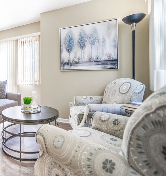 Townhome great room with living area, faux plank flooring, and sliding glass doors to private deck