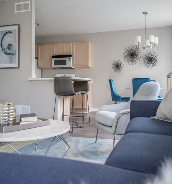 View from living area of great room towards dining and kitchen area with breakfast bar