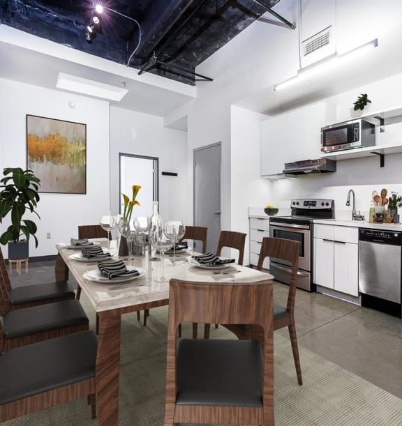 a kitchen with a stove top oven next to a table