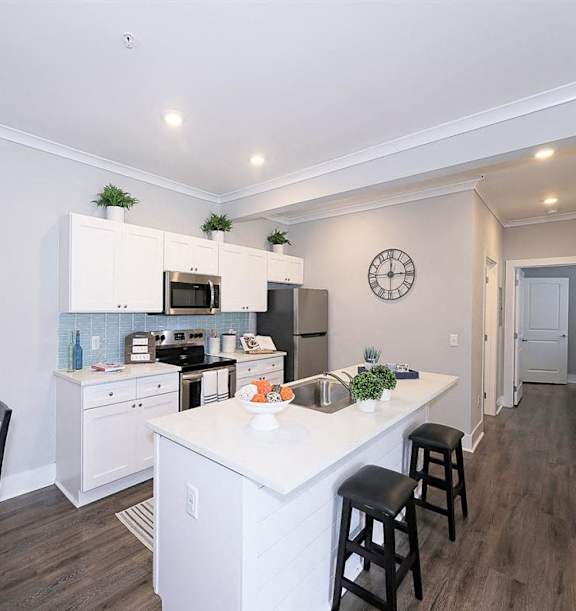 an open kitchen and dining area with a table and chairs