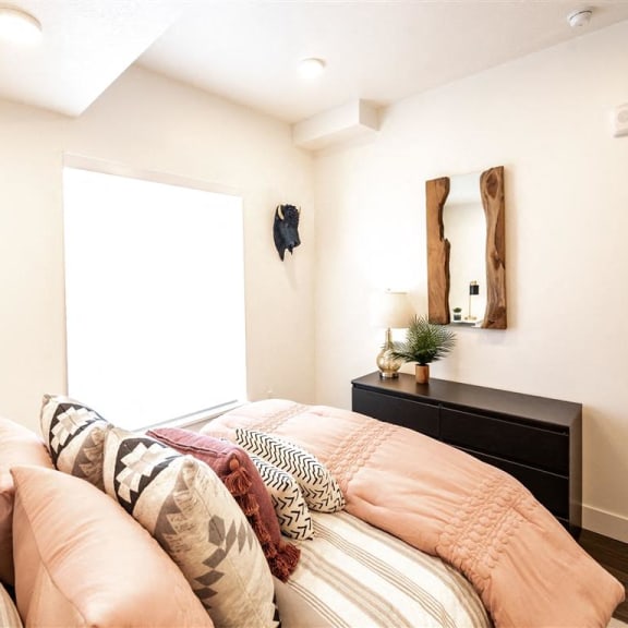 a bedroom with a bed and a dresser