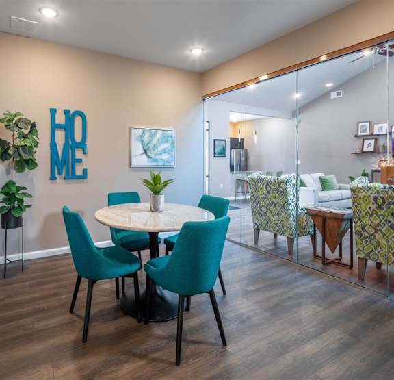 a dining room with a table and chairs