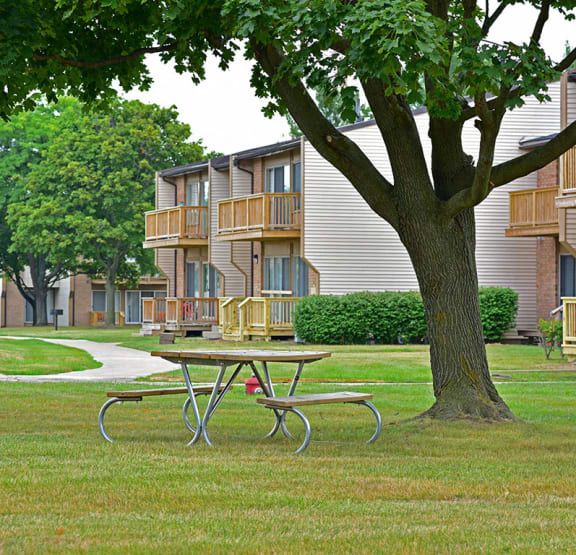 Grill and Picnic Table at Grand Bend Club Apartments in Grand Blanc