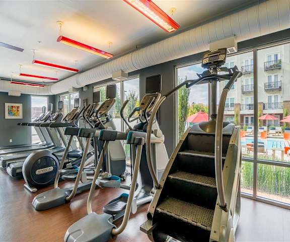The gym with cardo machines at Parkside at Firewheel Apartments. 