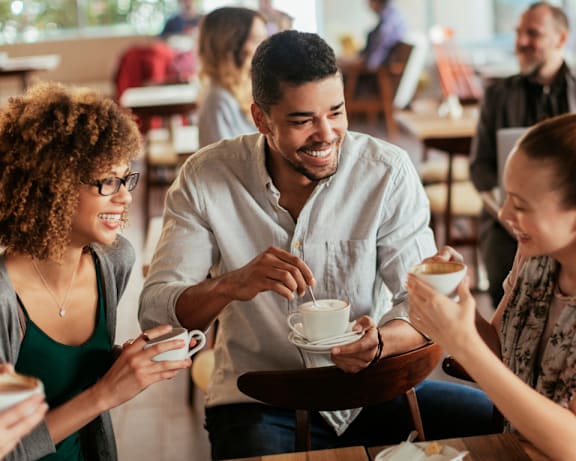 A group of people are enjoying a coffee break together.
