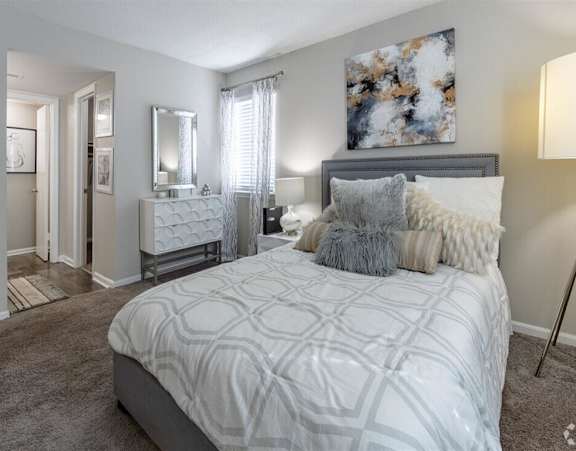 a bedroom with a bed and a closet at Tucker Square, Stone Mountain
