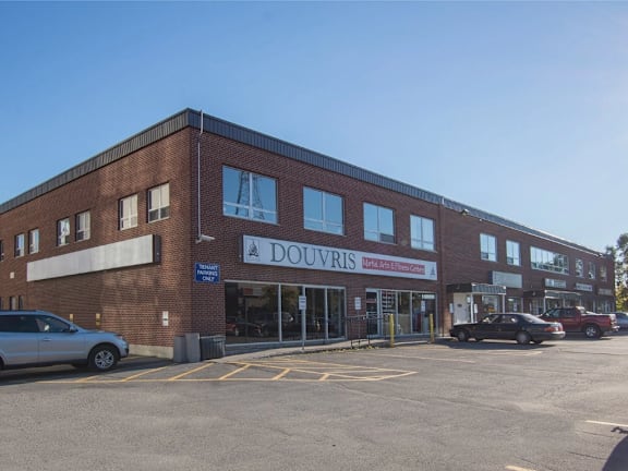 A brick building with a sign that says "DOUVRIS" on it.