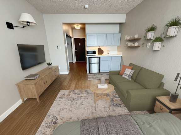 A living room with a fireplace and a painting on the wall.at LSOP-Lakeside, LLC Apartments, Reno, NV