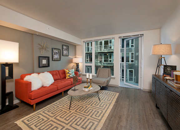 Living room with walk out patio at Infinity Apartments in Seattle WA
