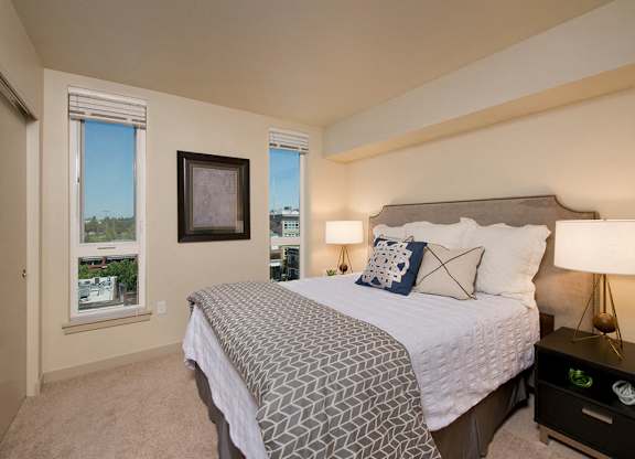 Bedroom with windows at Infinity Apartments in Seattle WA