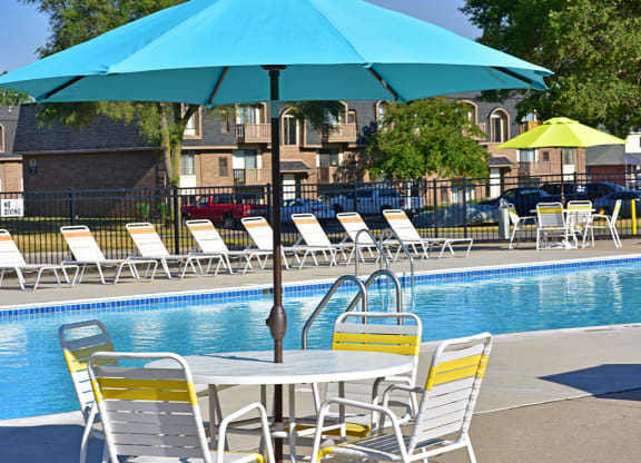 Poolside Seating with Umbrella at Windsor Place, Davison, MI, 48423