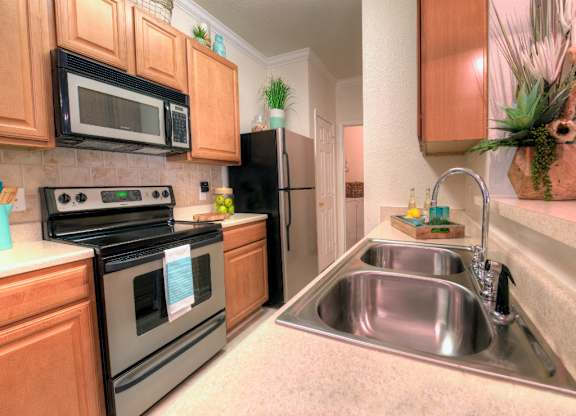 Spacious kitchens include plenty of above and below cabinet storage in addition to a complete appliance package.