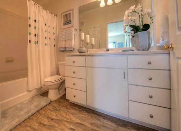 Every bathroom contains ample cabinet storage to keep clutter at bay.