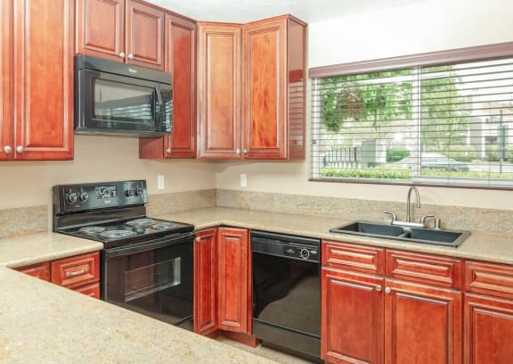 Kitchen with Black Appliances at Chesapeake Commons