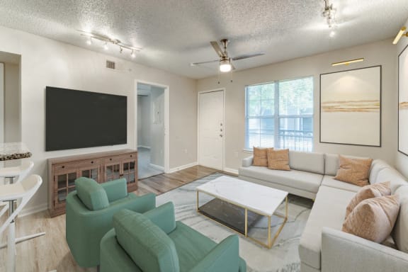 a living room with a couch and a coffee table  at Vibe on Riverside, Austin, TX