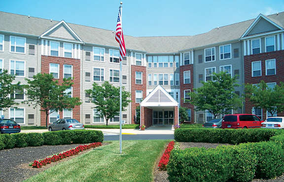 A large building with a flag on top of a pole.