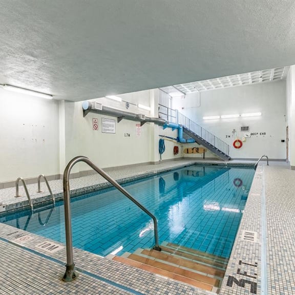 a swimming pool with a ladder on the side of it