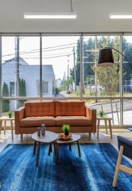 a living room with a couch and two chairs at Jefferson Yards, Tacoma, WA 98402