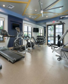 a gym with treadmills and other exercise equipment  at The Grove at Portofino Vineyards, Fort Myers, FL