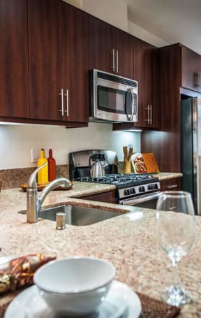 a kitchen with a sink and a counter top at The Vines at Riverpark, LLC, California, 93036