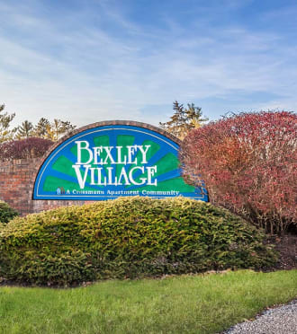 the sign at the entrance to bath farms with flowers