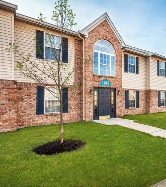 a white house with a driveway and a garage door