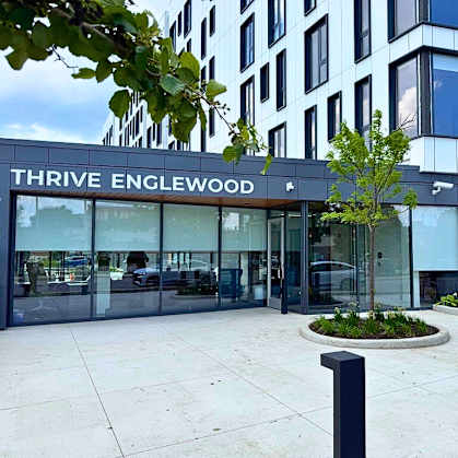The Thrive Englewood building has a modern design with a glass facade.