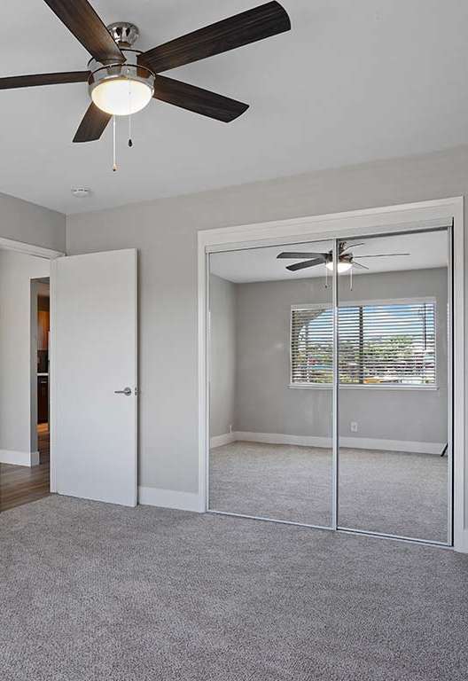 Spacious bedroom with ceiling fan at Colonial Garden Apartments, San Mateo, 94401