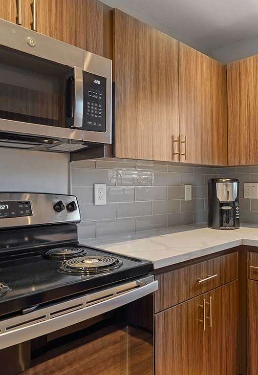 Upgraded kitchen with stainless steel appliances at Colonial Garden Apartments, San Mateo, 94401