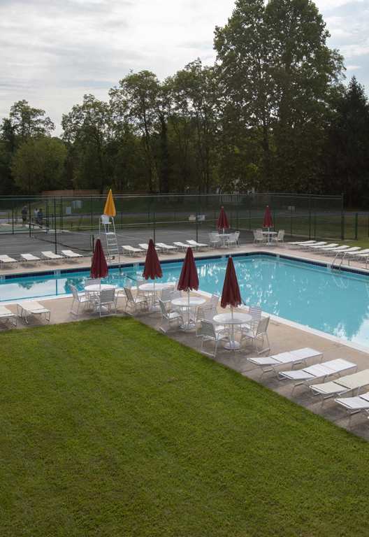 Large swimming pool with lounge area at Cromwell Valley Apartments in Towson, MD