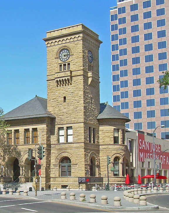 a building with a clock tower on a city street