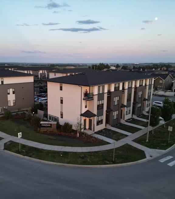 Apartment complex with a roundabout in front.