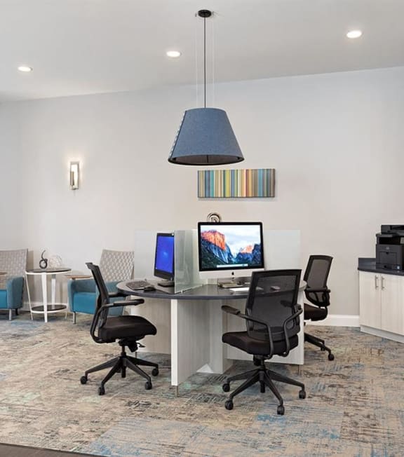 a home office with a desk with two computers and a monitor at Addison Crater Woods, Petersburg, Virginia