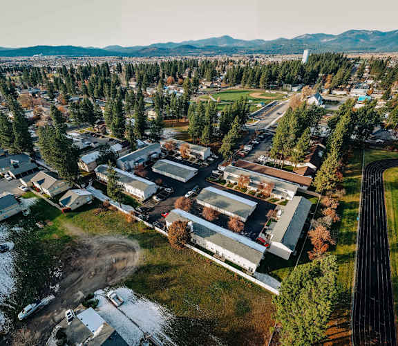 arial view of the campus with a train track in the foreground