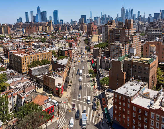 A cityscape with a mix of modern and older buildings.