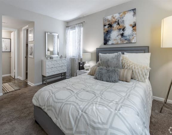 a bedroom with a bed and a closet at Tucker Square, Stone Mountain