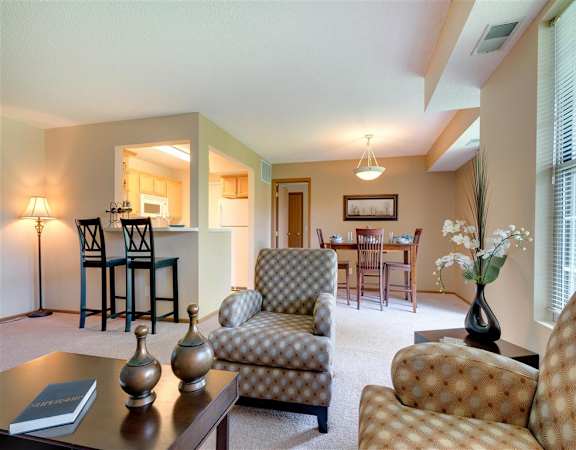 a living room with couches and a table  at Mallard Ridge, Minnesota