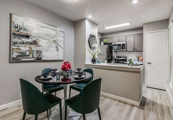 Modern kitchen with dining area at The Melville Apartments