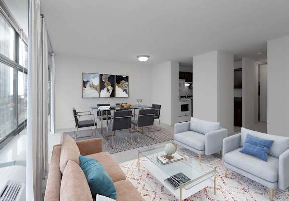 A living room with a couch, chairs, and a coffee table.