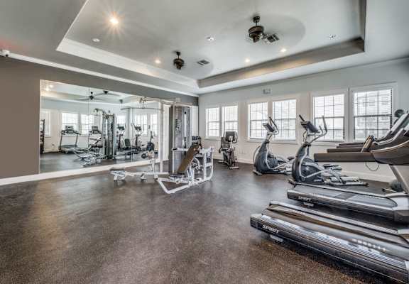 the gym with treadmills and weights at the preserve apartments  at Valor at Harlingen, Harlingen, Texas