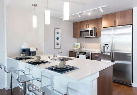 View of kitchen and breakfast bar at Lyric, California, 94596