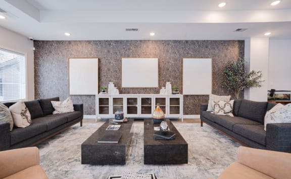 a living room with couches and a coffee table