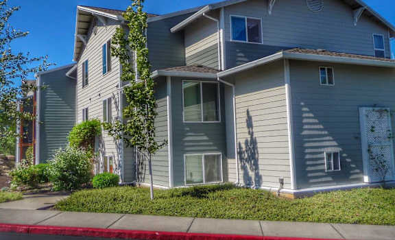 a blue house with a sidewalk in front of it at Troutdale Terrace, Troutdale, Oregon