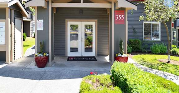 The front entrance of the leasing office at THE MEADOWS BY VINTAGE, Bellingham, Washington