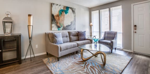 Living Room With Plenty Of Natural Light at Falls on Clearwood Apartments, Richardson, TX