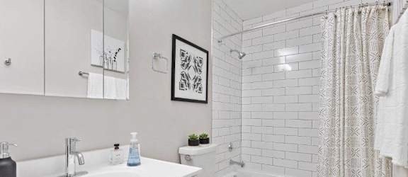 a bathroom with a sink toilet and bathtub