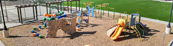 a playground with a swing set and other playground equipment