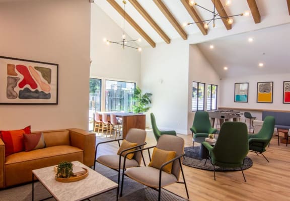 a living room filled with furniture and a table with chairs at Parc Medallion LLC, Union City, CA 94587