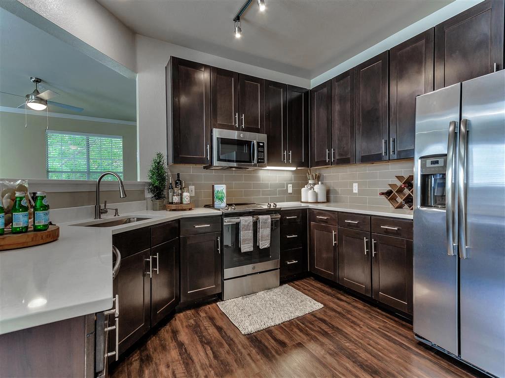 The Caruth Premier Townhome Apartments kitchen - Dallas, TX