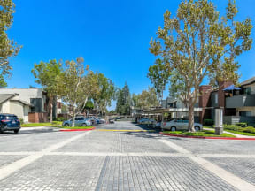 Apartments in Ontario - Exterior View of Avante Apartments' Leasing Office, Surrounded by Lush Landscaping and Walkways